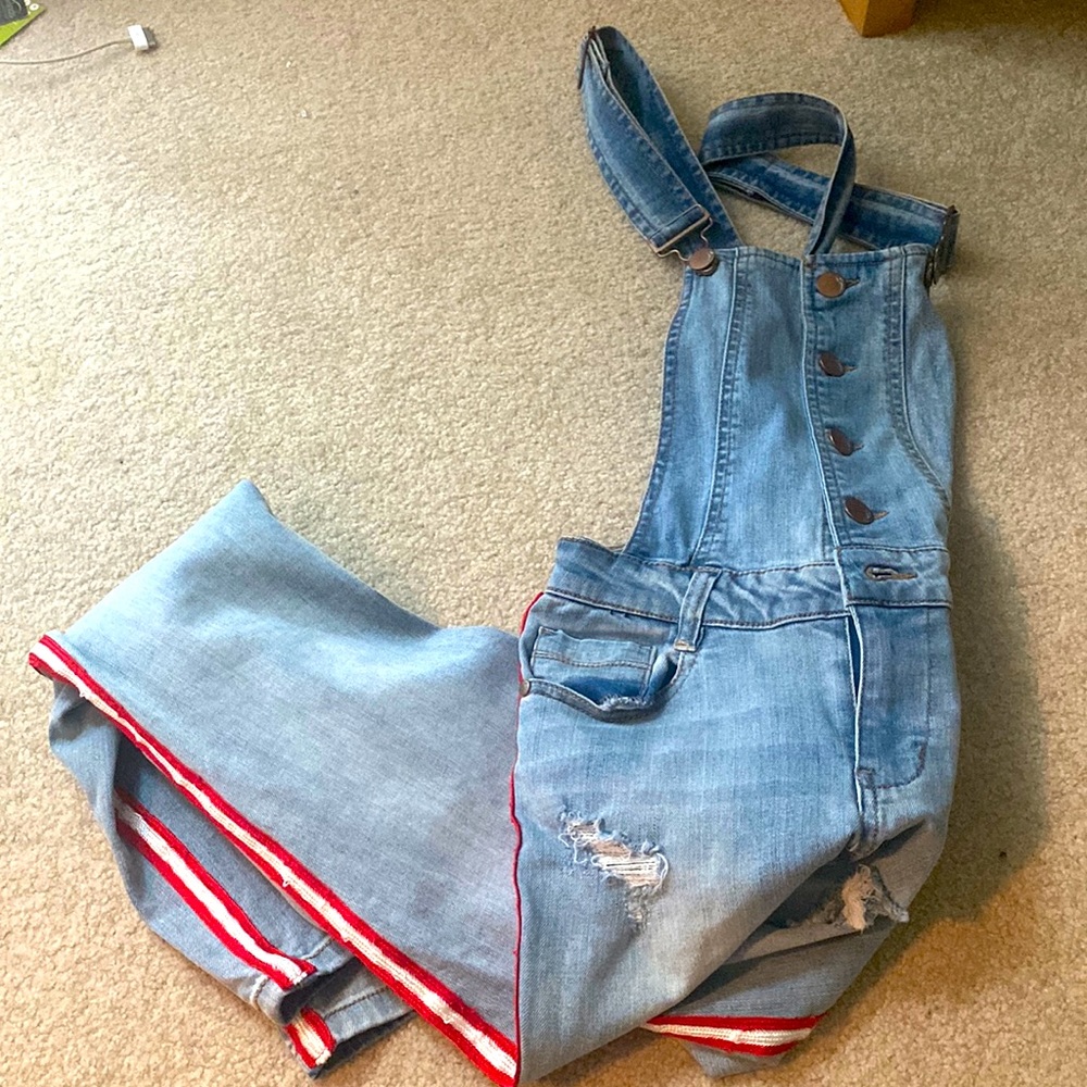 Denim overalls with red and white side stitching